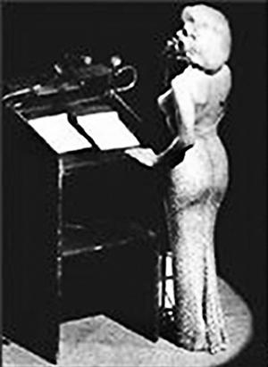 Milton Ebbins pushed Monroe onstage for her famous rendition of Happy Birthday (Mr President).jpg